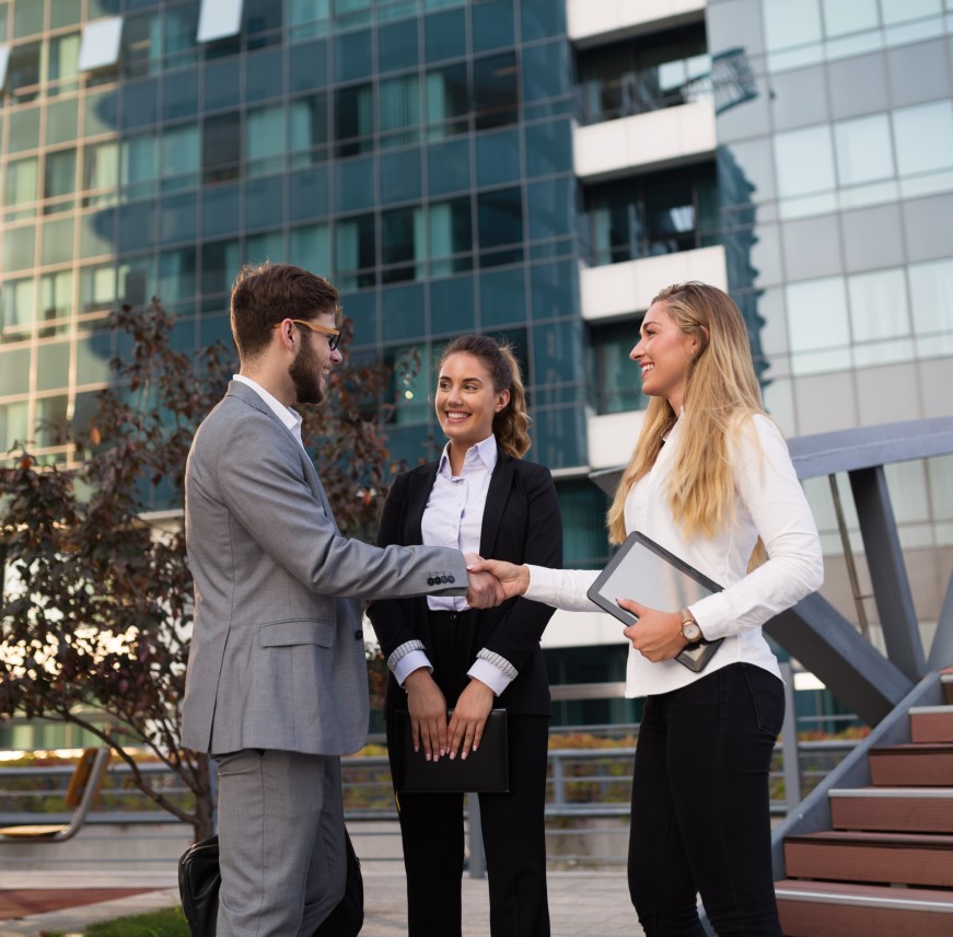 Two young businessmen using-touchpad analysis business chart document meeting