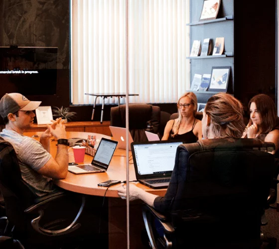 A group of important people in a conference room.