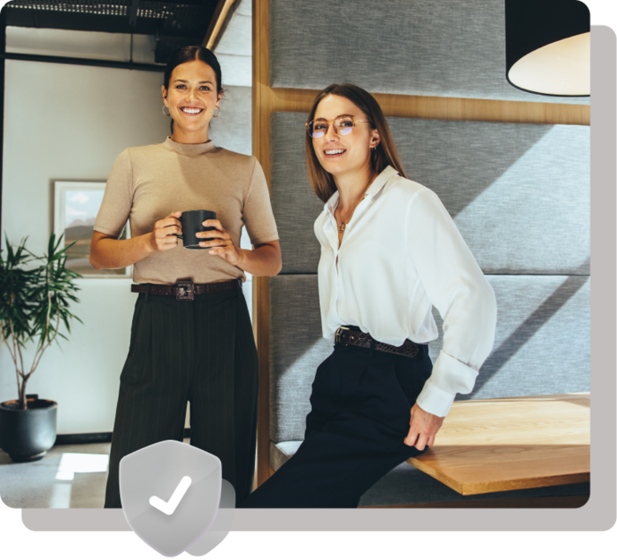 Two young business woman in a Cowork space.